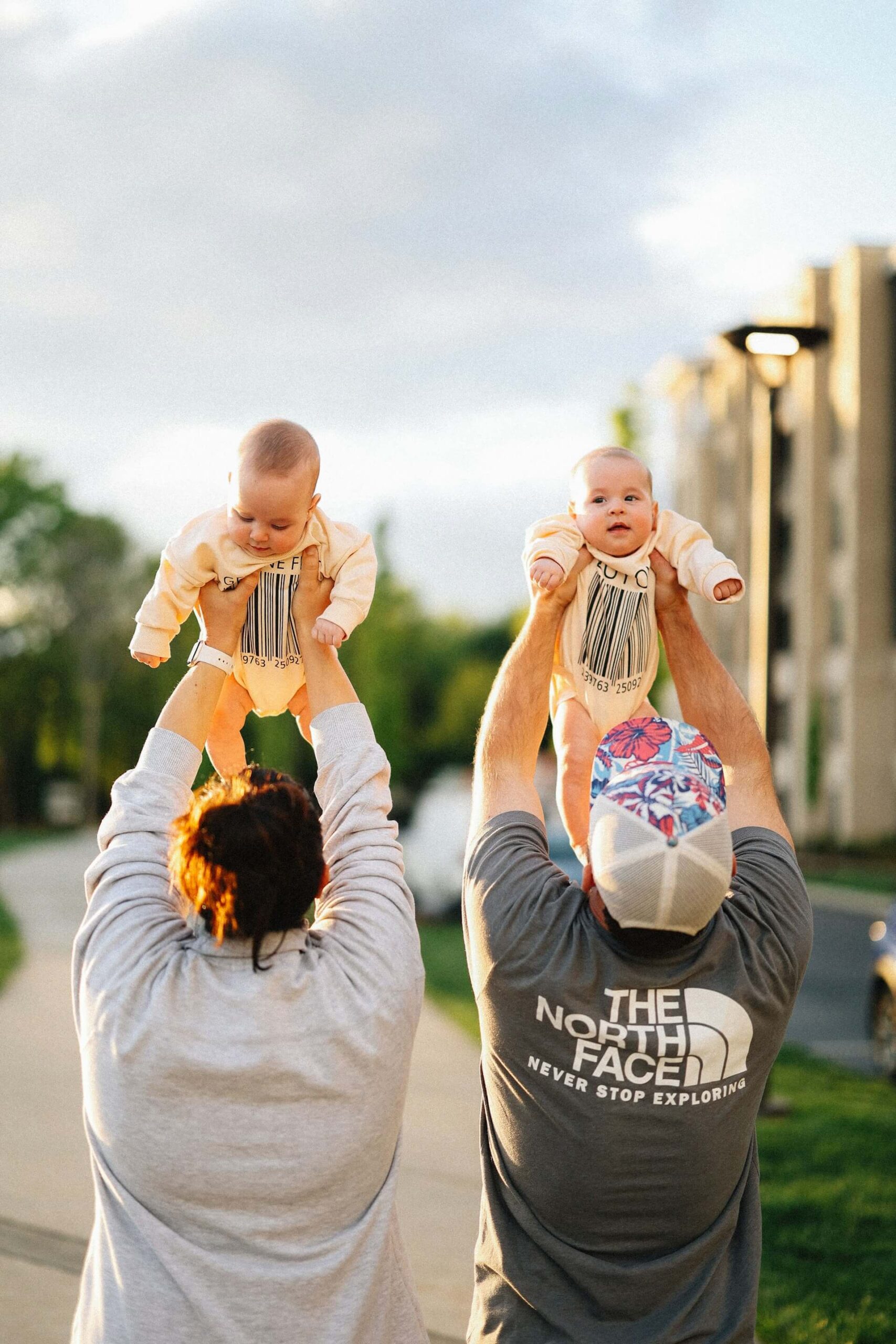 brooke-balentine-zCJ3H_6tPKY-unsplash parents holding babies